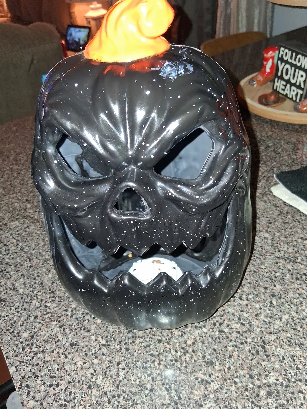 Glowing Black Plastic Jack-O'-Lantern with Led Lights.